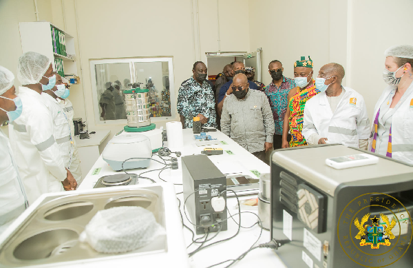  President Akufo-Addo (arrowed) inspecting some facilities at the new factory in Kumasi. With him are Mr Alan Kyerematen (left) and some officials of the company