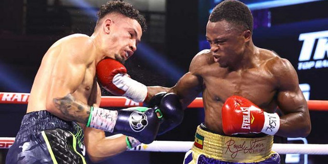 Isaac Dogboe (right) earned a majority decision victory over Adam Lopez