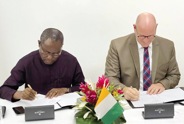 Mr Joseph Boahen Aidoo (left), CEO, COCOBOD, and Mr Heiko Feuring, the President of Buhler for the Middle East and Africa, signing the memorandum of understanding to process more cocoa in Abidjan, Cote d’Ivoire