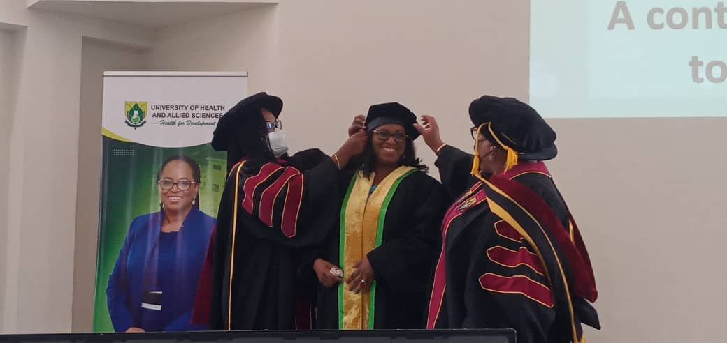 Professor Evelyn Korkor Ansah being robed to deliver her lecture 