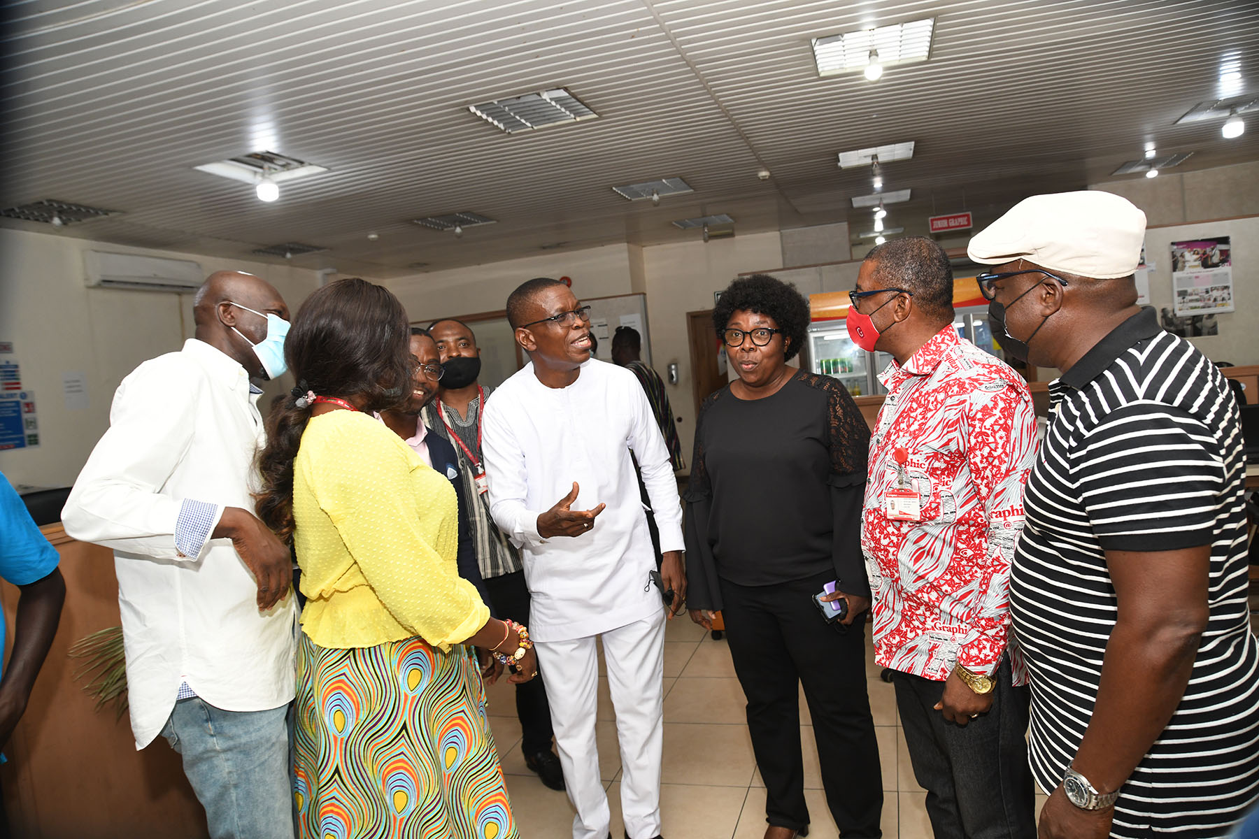 Mr Dave Agbenu (4th right) and some members of his entourage holding discussions with Mr Kobby Asmah (2nd right), the Editor of the Daily Graphic, Ms Kate Baaba Hudson (3rd right), Editor of the Junior Graphic, in the Daily Graphic newsroom. Picture: EBOW HANSON