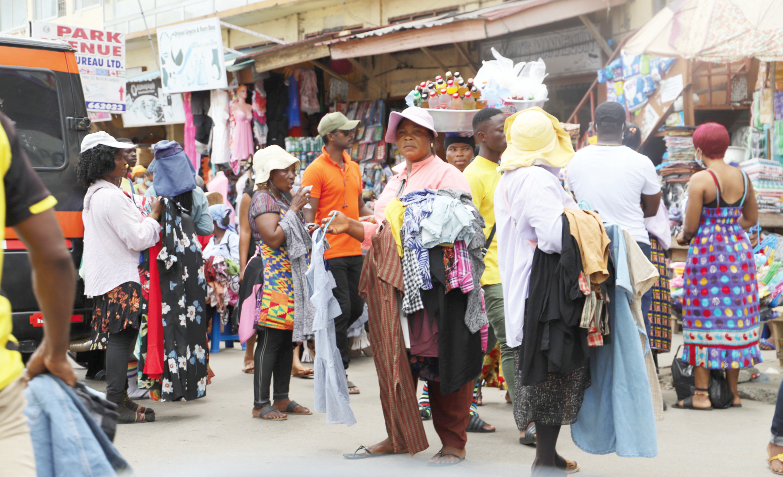 Some traders and buyers carrying out their day-to-day activities at the central business district of Accra without being in face masks