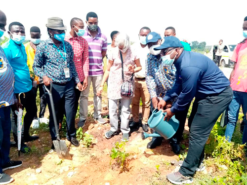 Prof Samuel Nii Odai (2nd right), Vice-Chancellor of ATU and Prof Amevi Acakpovi (right), Pro Vice-Chancellor of the university, watering a seedling they had planted