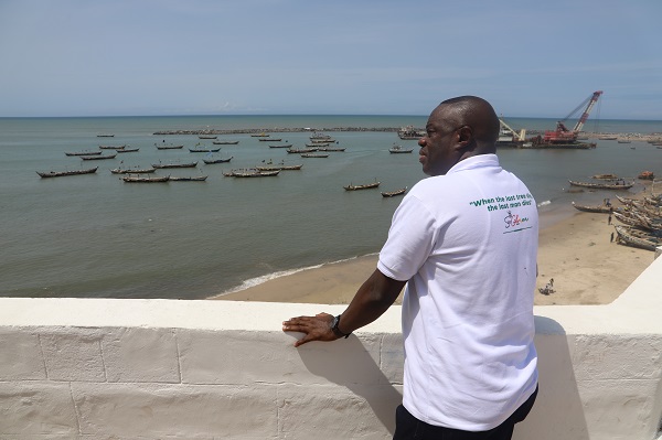 Dr. Mohammed Awal (3rd left),Tourism Minister viewing the shore form the Usher Fort at Jamestown in Accra