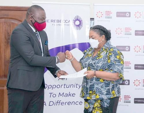 Mrs Rebecca Akufo-Addo, Executive Director of the Rebecca Foundation, exchanging the MOU with Mr Ubon Udoh, Managing Director of ASR Africa