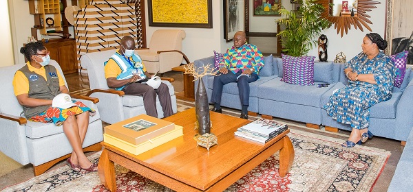  Prof. Samuel Kobina Annim (seated second left), Government Statistician and his colleague interacting with President Akufo-Addo and Mrs Rebecca Akufo-Addo (right), First Lady