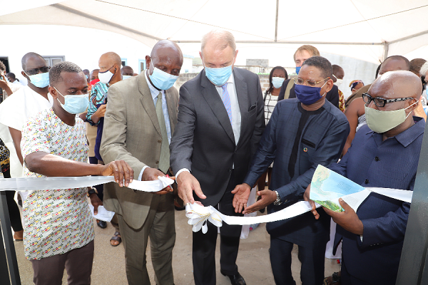 Mr Ron Strikker (right) the Netherlands Ambassador to Ghana, being supported by Mr Abdourahaman Diallo (2nd right), UNESCO Representative in Ghana, Mr Agyeman Duah (right) acting Director of the Ghana Museums and Monuments Board, and other officials to cut the tape to inaugurate the Usser Fort Museum in Accra
