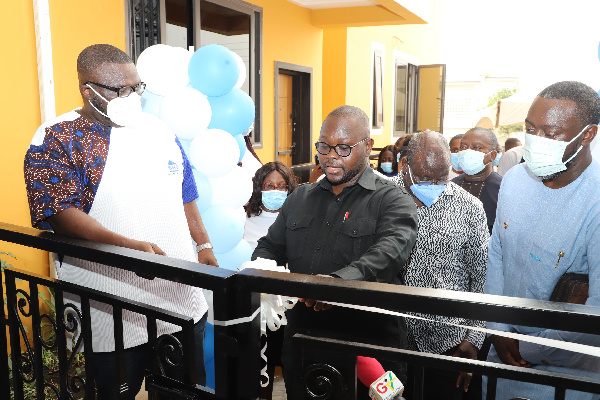  Mr Francis Asenso Boakye (3rd right), the Minister of Works and Housing, being assisted by Mr Kwabena Ampofo Appiah (left), the Managing Director of the State Housing Company, to inaugurate the  apartment at North Kaneshie in Accra. With them are Mr Solomon Asoalla (2nd right), the Chief Director of the Ministry of Works and Housing, and other officials. Pictures: GABRIEL AHIABOR
