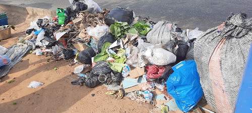 One of the heaps of garbage at the CMB market where many families buy their foodstuff