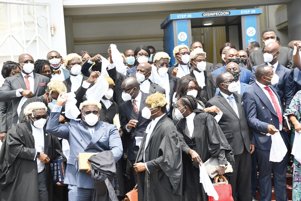  Members of President Akufo-Addo’s legal team and some executive members of the NPP waving white handkerchiefs as a sign of victory after the judgment. Picture: EBOW HANSON