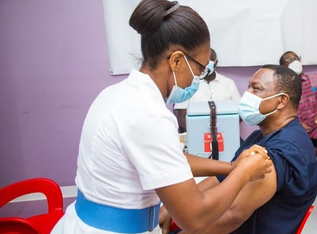 Rev Sam Korankye Ankrah receiving his first Covid-19 vaccine