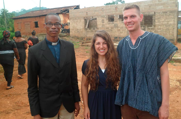 Ms Bretaen Rovb (middle) and Mr Peter Vaney (in smock), another member of the Peace Corps, with Reverend Willington Klutse, their host