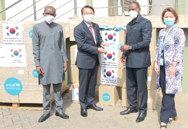  Mr Jung-Taek Lim (2nd left), the South Korean Ambassador to Ghana, presenting the N-95 face  masks to Dr Patrick Kuma-Aboagye (2nd right), Director-General of the Ghana Health Service (GHS). With them are Ms Anne-Claire Dufay (right), UNICEF Representative in Ghana and Dr Franklin Asiedu-Bekoe (left), Director of Public Health of the GHS. Picture: ESTHER ADJEI