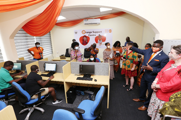 Mr Niyi Ojuolape (2nd right), UNFPA Country Representative, explaining the functions of the call centre to some dignitaries and participants. Picture: NII MARTEY M. BOTCHWAY