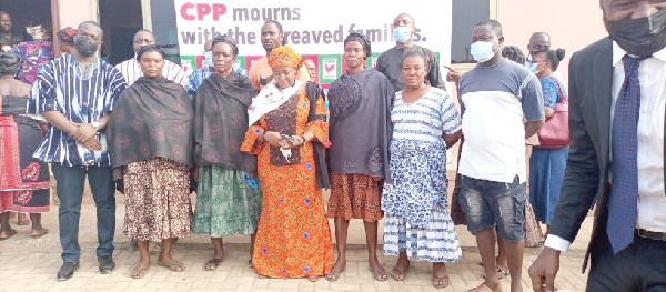 Nana Akosua Frimponmaa Sarpong-Kumankumah (middle), Chairperson of CPP, with some of the bereaved families 