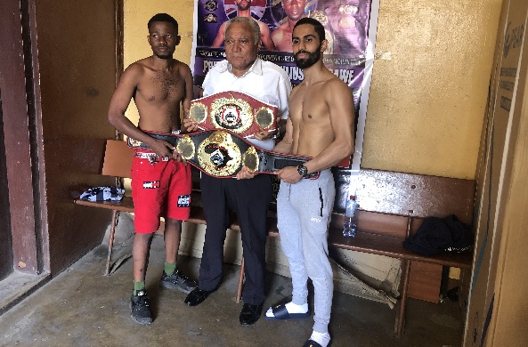 Mr Samir Captan, the WBO Africa supervisor (middle) displays the belts with Prince Patel and Julius Kisarawe (left)