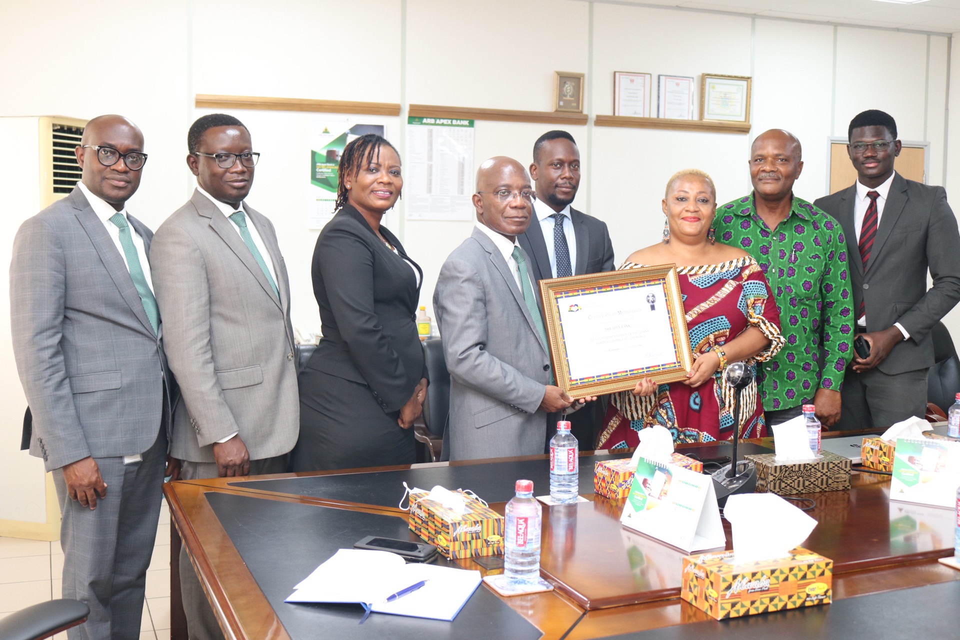Kojo Mattah, Managing Director of ARB Apex Bank receiving the certificate from Pearl Delali Doledzi, while Isaac Vanderpuije, Founder of the Chamber (2nd from right) and Oswald Anonadaga, CEO of Floodgate Limited (extreme right) looks on.