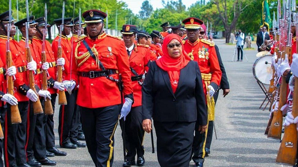 President Samia inspects a guard of honour after being sworn in as the sixth president of Tanzania
