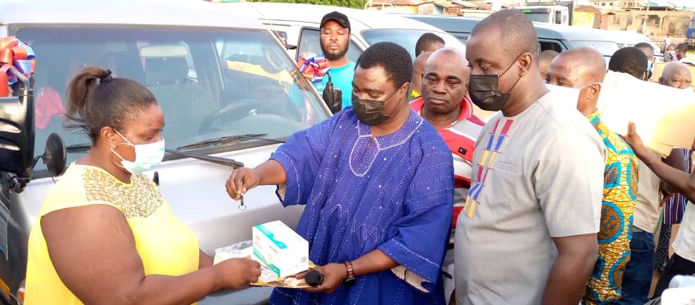 Mr Asante (right), the MP for Suhum, presenting a key to a 12-seater Hyundai Grace minibus to Mrs Charlotte Yeboah, one of the beneficiaries.