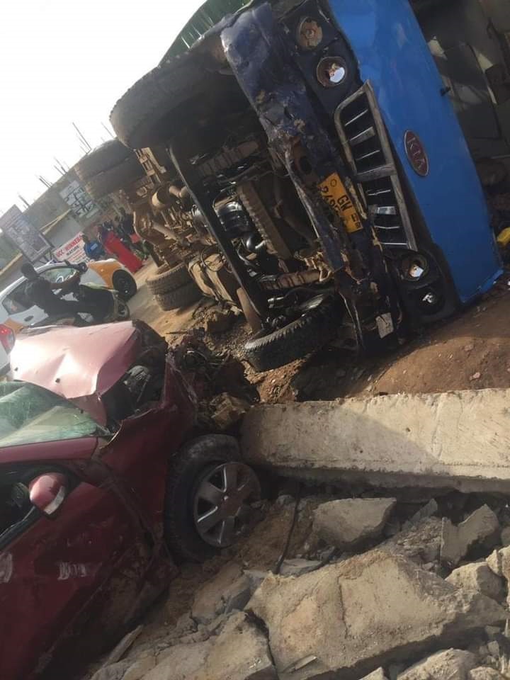 The bus collided with a Toyota Corolla Saloon car with registration number GW 2893-14 at the school’s junction on the Ahmadiyya hospital road and landed on its side and also severely damaged the fence wall of the Adeyhe Assembly of the Apostolic Church Ghana.
