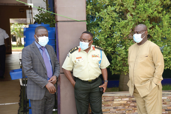 Major General Francis Ofori (middle), Commandant, Kofi Annan International Peace-keeping Training Centre, interacting with Dr Emmanuel Kwesi Aning (right), Director, Faculty of Academic Affairs &amp; Research, KAIPTC, and Mr Benjamin Serebour (left), Coordinator for the course
