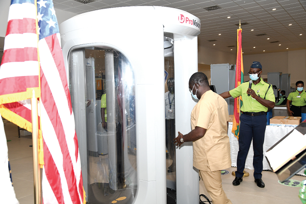 Mr Kwaku Ofori Asiamah (left), the Minister of Transport, going through the equipment during a demonstration by an official of the Ghana Civil Aviation Authority. Picture: EBOW HANSON