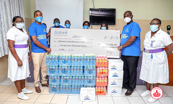 Mr Jude Matti (left), Trade Marketing Manager of Kasapreko Company Limited, presenting a dummy cheque to Dr Lawrence Sereboe, Director of the National Cardiothoracic Centre 