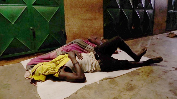 These people were spotted sleeping by a smelly gutter and rubbish at the Central Business District.
