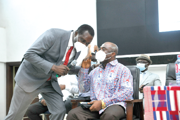  Dr Yaw Osei Adutwum, Minister of Education, confering with Mr Thomas Musah, the GNAT General Secretary, after the launch 