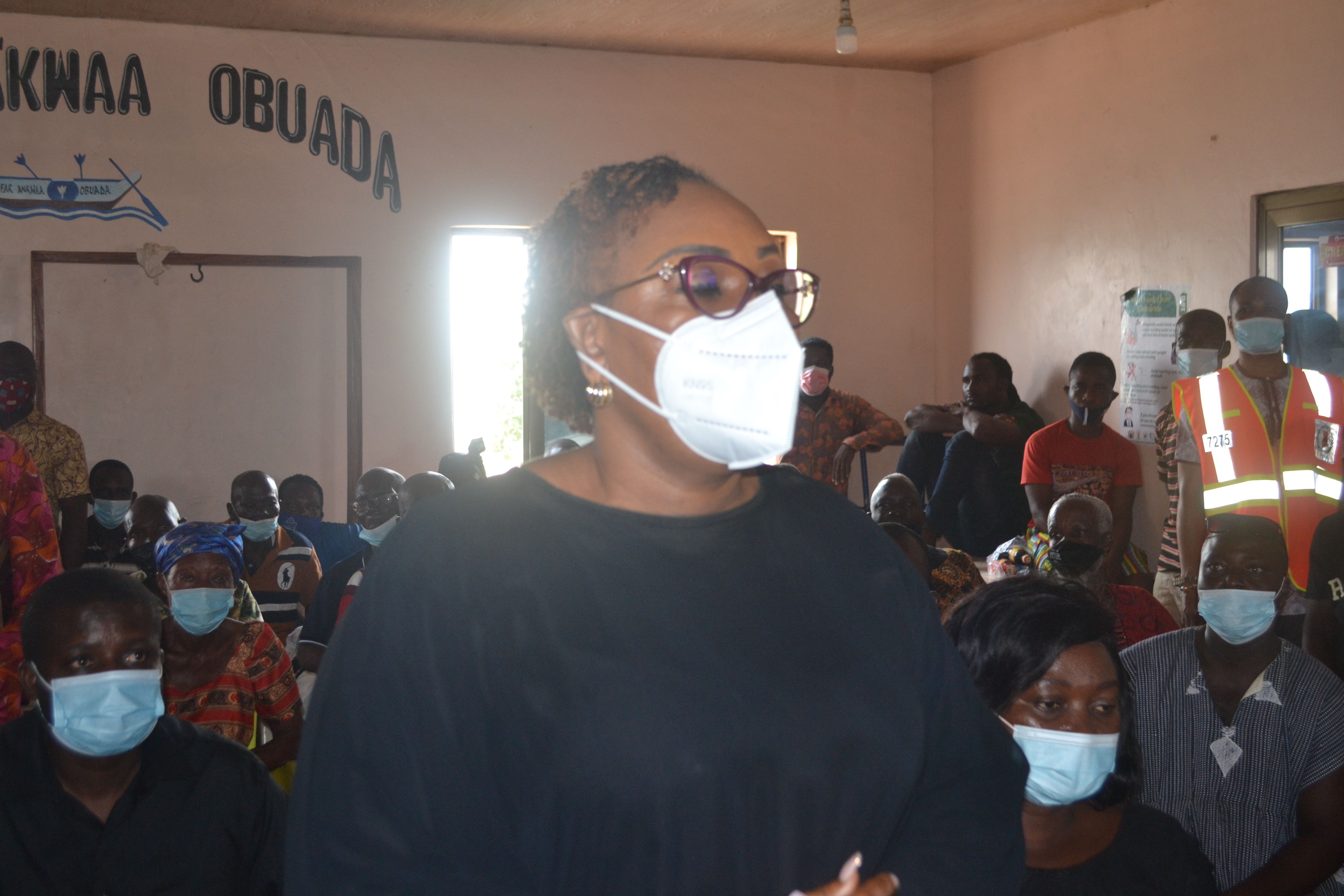 Madam  Mavis Hawa Koomson (left), Fisheries Minister, addressing the bereaved families during the visit