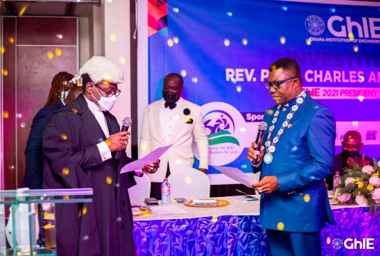Justice Yonny Kulendi (left) , a justice of the Supreme Court, administering the induction oath on Prof. Charles Anum Adams ( right)