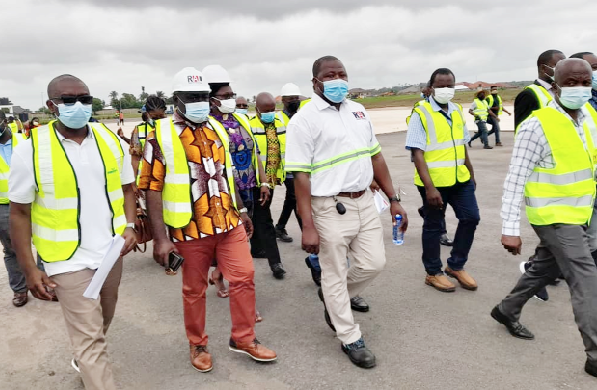  Mr Kwaku Ofori Asiamah (2nd left), Minister of Transport, being led by officials of the Ghana Airports Company to inspect the ongoing rehabilitation of the runway of the Sunyani Airport