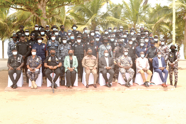 • Mr George Mireku Duker (arrowed), the Deputy Minister-designate of Lands and Natural Resources,  with dignitaries and some of the police personnel