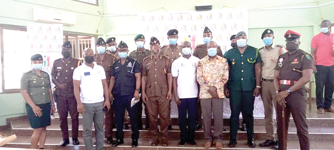 Some of the security personnel with officials of the National Commission for Civic Education