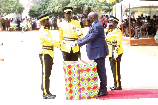 Vice-President Dr Mahamudu Bawumia (2nd right) presenting the Overall Best Cadet Award to Senior Under Officer Samuel Yankey (left). Picture: SAMUEL TEI ADANO  