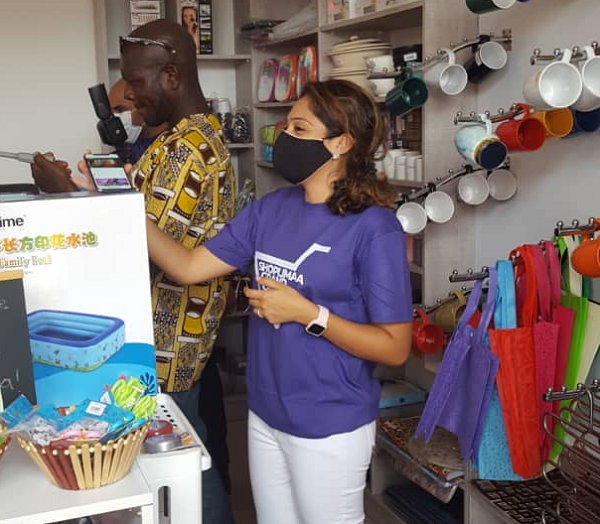 Chief Executive Officer of Limaa Enterprise, Madam Prisha Daryanani arranging some products at the shop