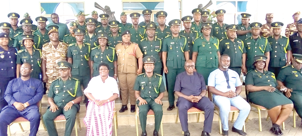  Mr Ambrose Dery (seated 3rd right), Interior Minister; Mr Kwame Asuah Takyi (seated middle), Comptroller-General of GIS, and Mr Isaac Appaw-Gyasi (seated 2nd right), Municipal Chief Executive for New Juaben South, with regional commanders of the Ghana Immigration Service and other sister security services after the opening ceremony of the conference