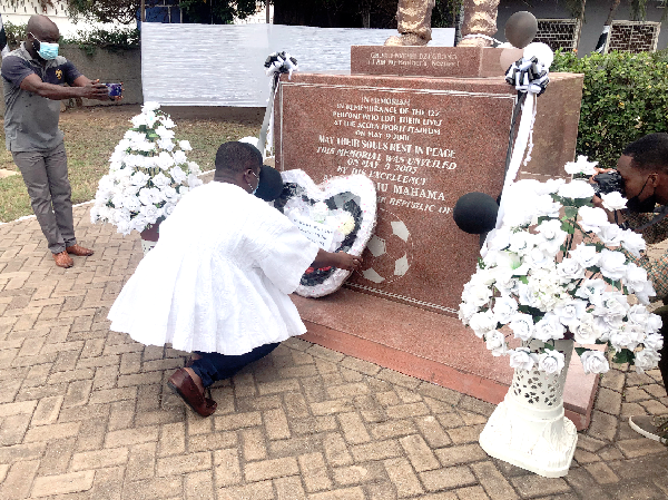Mr Mustapha Ussif, Minister of Youth and Sports, laying a wreath at the Accra Stadium to mark the commemoration 