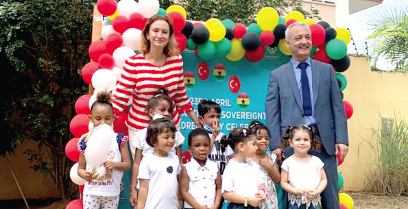  Mrs Ozlem Ergun Ulueren, Turkish Ambassador to Ghana, and Mr Zekai Özgün,  Director of  Maarif International School, with the pupils after the ceremony