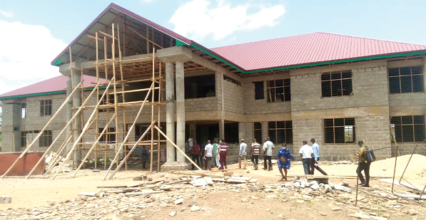 • Members of the Parliamentary Select Committee on Local Government and Rural Development inspecting the office complex of the Tempane District funded under the District Assemblies Common Fund