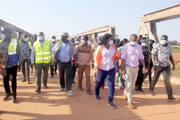 Mr Kwesi Amoako-Atta (2nd left), the Minister of Roads and Highways, being conducted around at one of the project sites