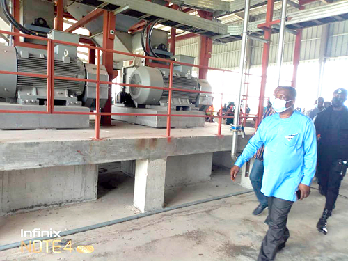 Mr Akwasi Adu-Gyan, the Bono East Regional Minister, inspecting facilities at the factory