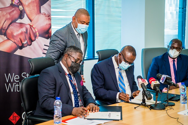 Managing Director of CBG, Mr. Daniel W. Addo and President and Chairman of the Board of Directors of EBID, Dr. George Agyekum Donkor signing off the loan deal.
