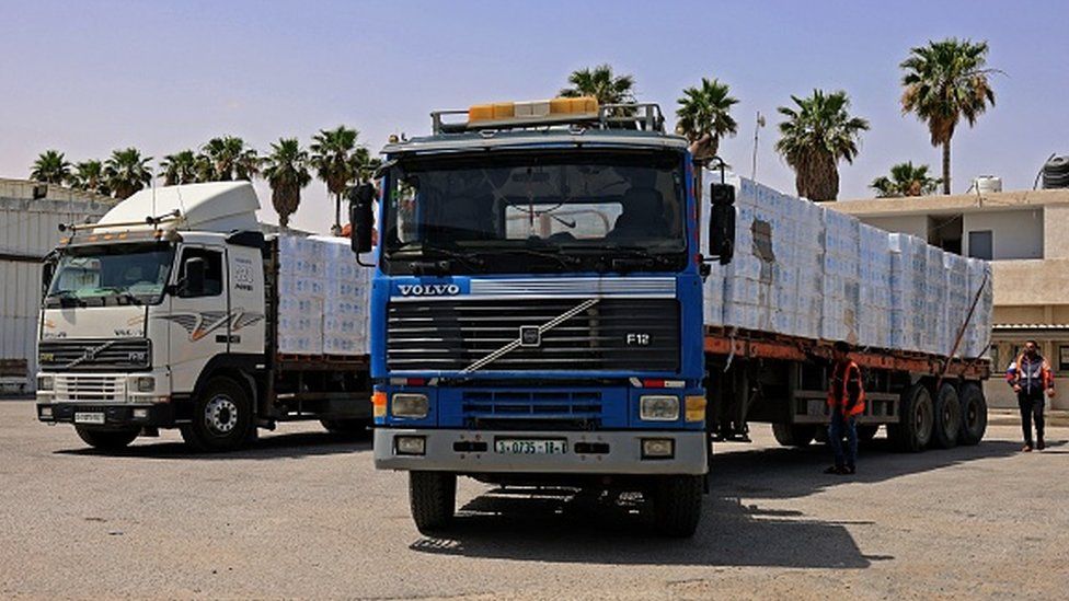 Trucks loaded with humanitarian aid passed into Gaza through the Kerem Shalom crossing on Friday