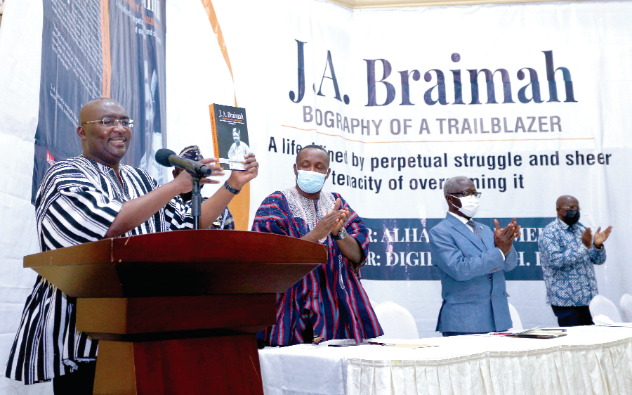 Dr Mahamudu Bawumia launching the book while Mr John Boadu (2nd left), NPP General Secretary, Mr Yaw Osafo-Maafo (2nd right), Senior Presidential Advisor, and Mr Hackman Owusu Agyeman (right), Chairman of the Council of Elders of the NPP, applaud.  Picture: NII MARTEY M. BOTCHWAY