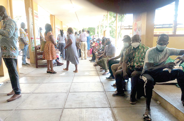 Some of the people waiting for their turn to take the jab at the Adabraka Polyclinic