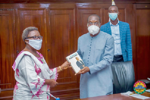 Dr Helen Osei, National Coordinator of Universal Peace Federation, presenting an autobiography of Rev. Dr Sun Myung Moon, Co-Founder of the Federation, to Mr Bagbin.
