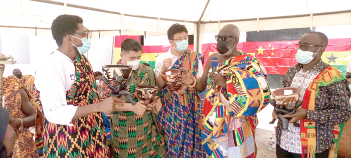 Mr Kojo Mamphey (right), Chief Executive Officer of Mamdev and Osabarimba Kwesi Atta II (2nd right), interacting with some of the collaborating investors after the ceremony