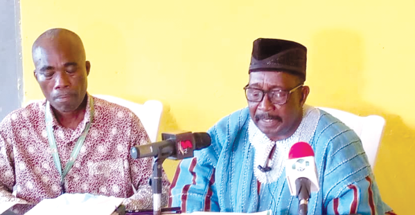 Mr Dubik Mahama Yakubu (right in smock), the Chairman of the Northern Regional Lands Commission addressing the press conference in Tamale. On his left is Mr Benjamin Jojoe Adu-Hanson, Regional Surveyor