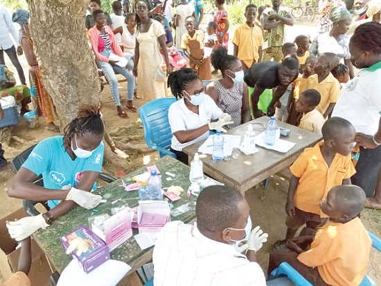  Health workers screening some residents of Atatam for malaria